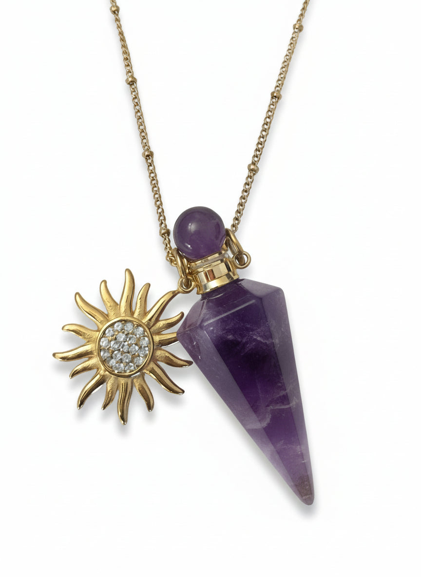 Amethyst crystal perfume pendant bottle Necklace with a gold sun design on a white background