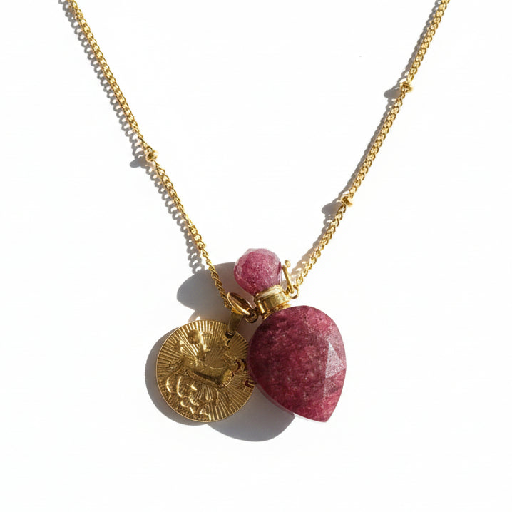 Aries zodiac necklace with strawberry quartz crystal pendant bottle