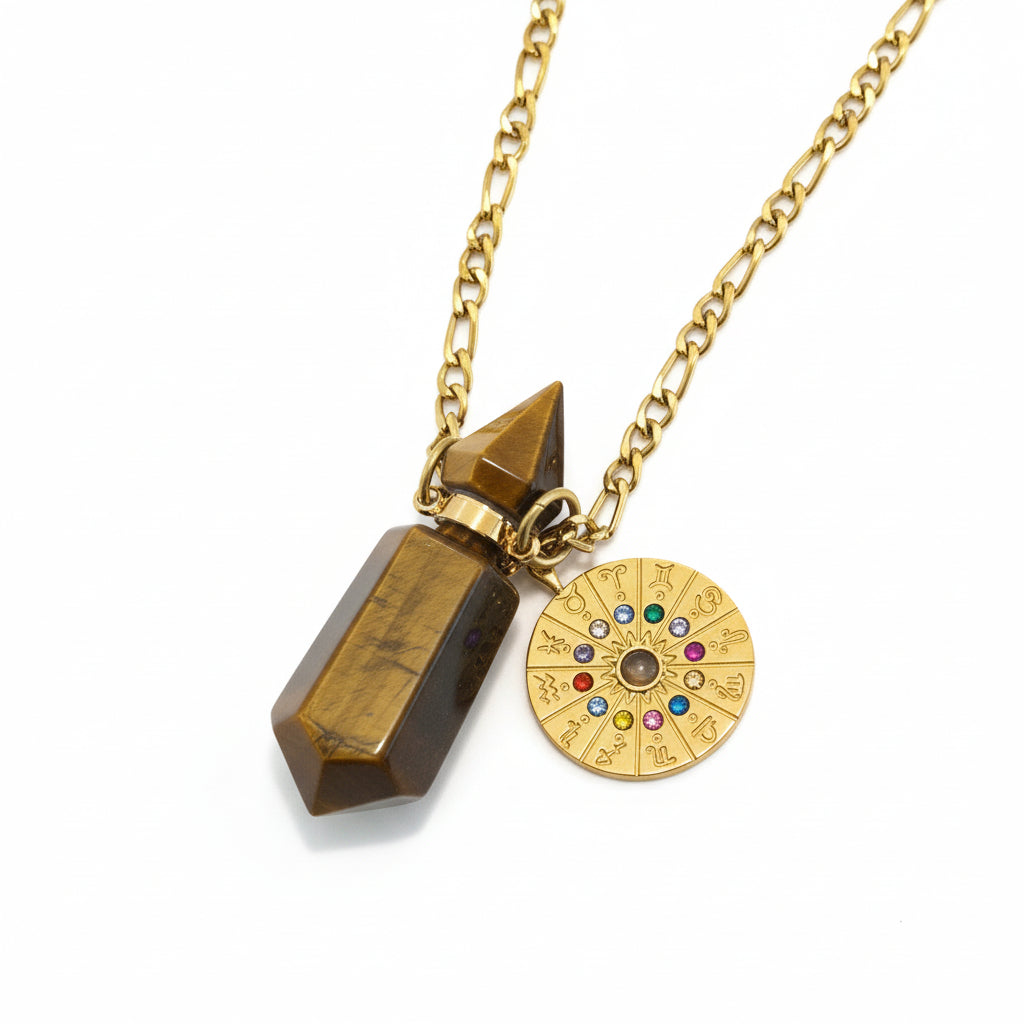 Zodiac necklace with Tiger eye geometric pendant bottle for perfume oil and zodiac clock charm on a beige stone surface